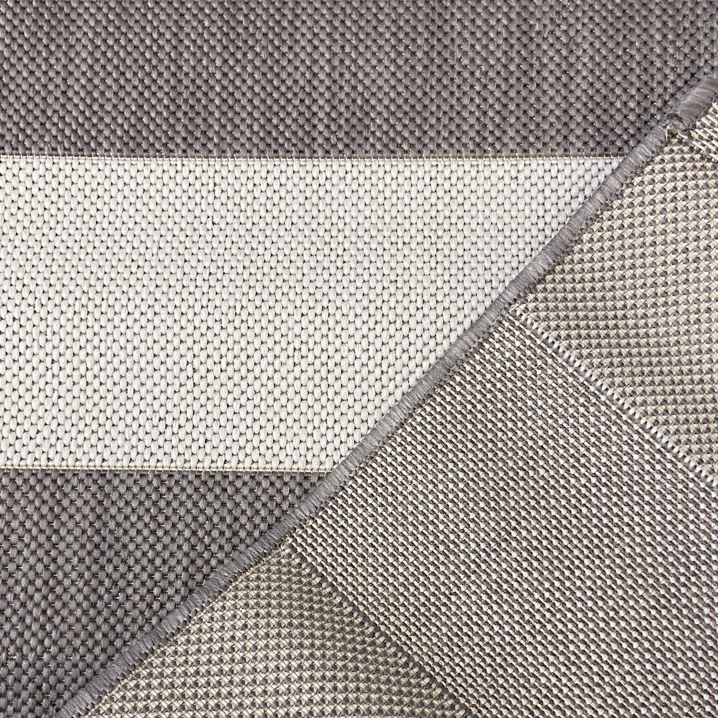 The chic and minimal beige and cream stripe outdoor rug with a muted beige chunky line design is an ideal choice for modern outdoor living.