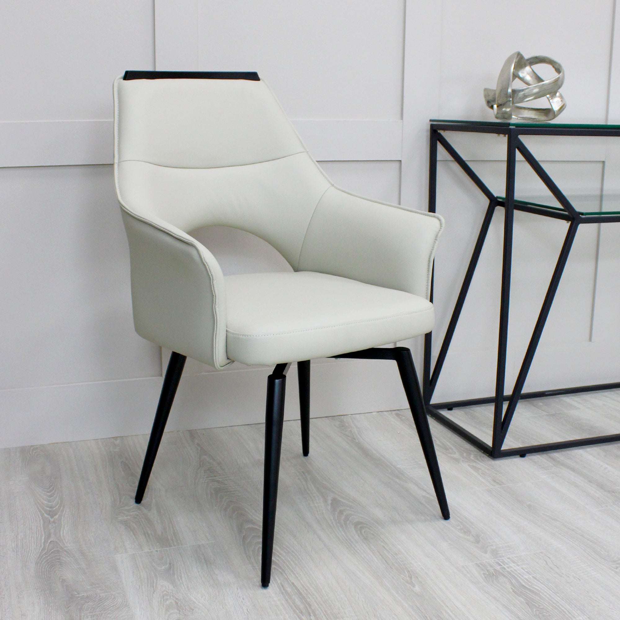 Esme Swivel Cream Leather Dining Chair Black Top Trim With Black Legs