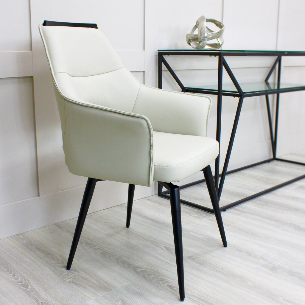 Esme Swivel Cream Leather Dining Chair Black Top Trim With Black Legs