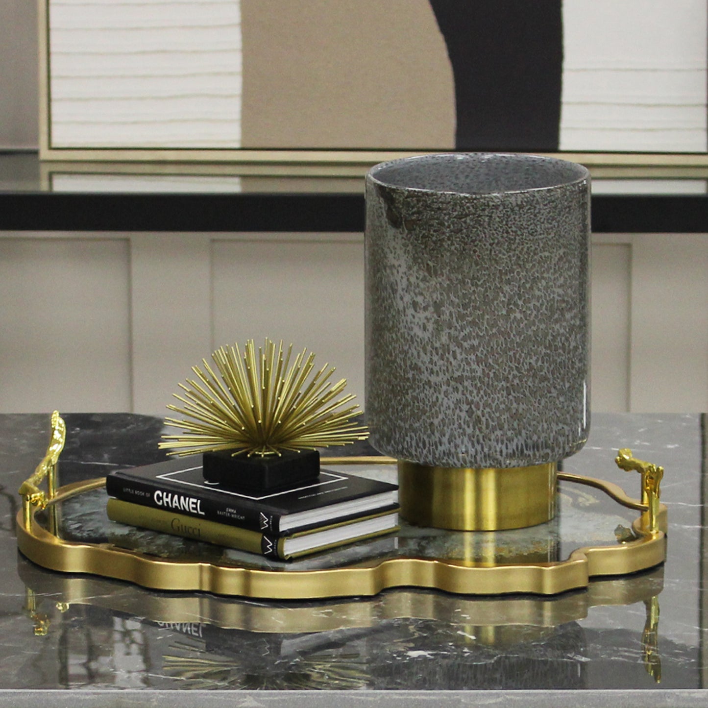 Grey glass vase with brass foot
