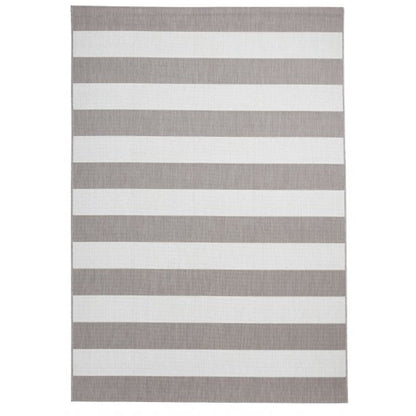 The chic and minimal beige and cream stripe outdoor rug with a muted beige chunky line design is an ideal choice for modern outdoor living.