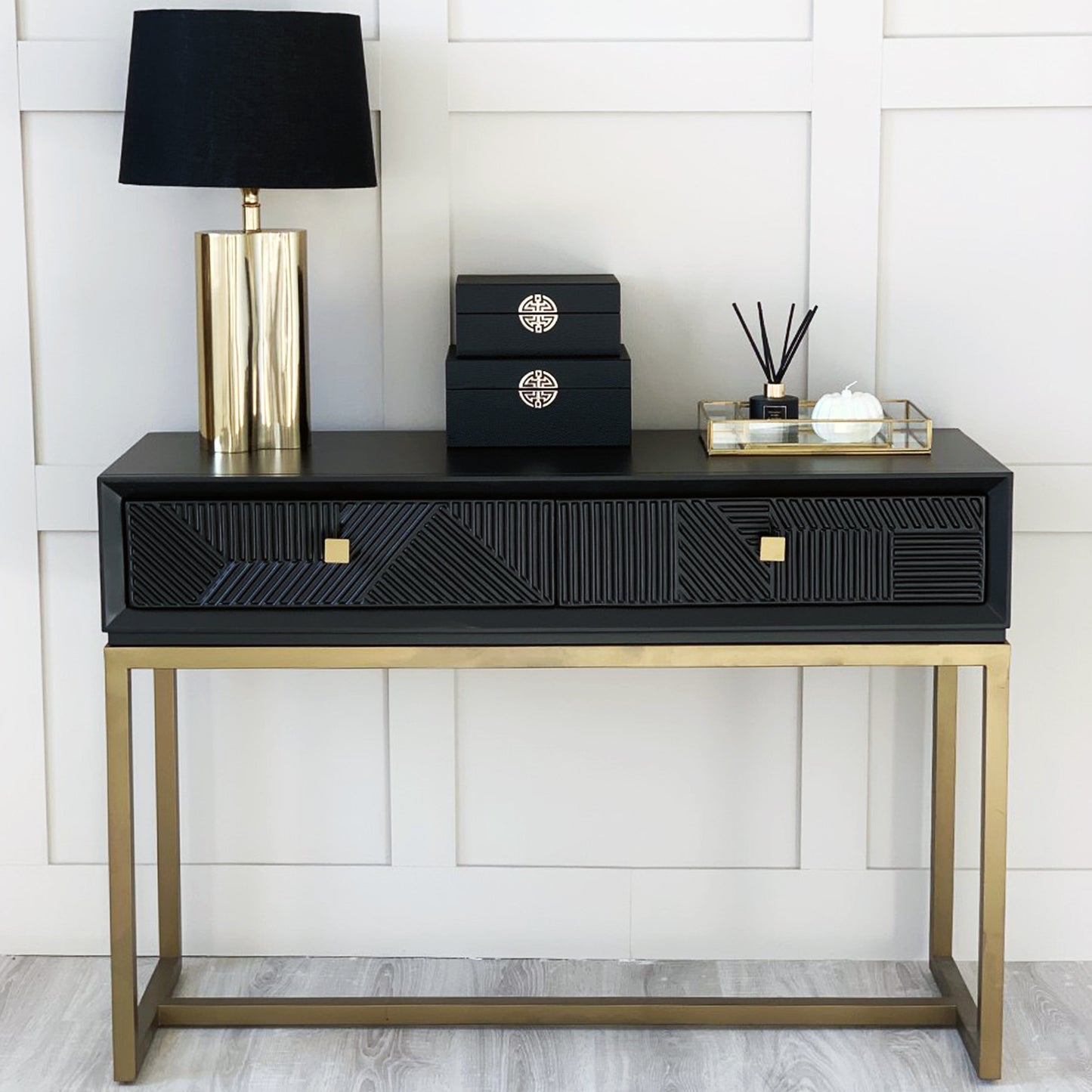 geometric black and gold console table