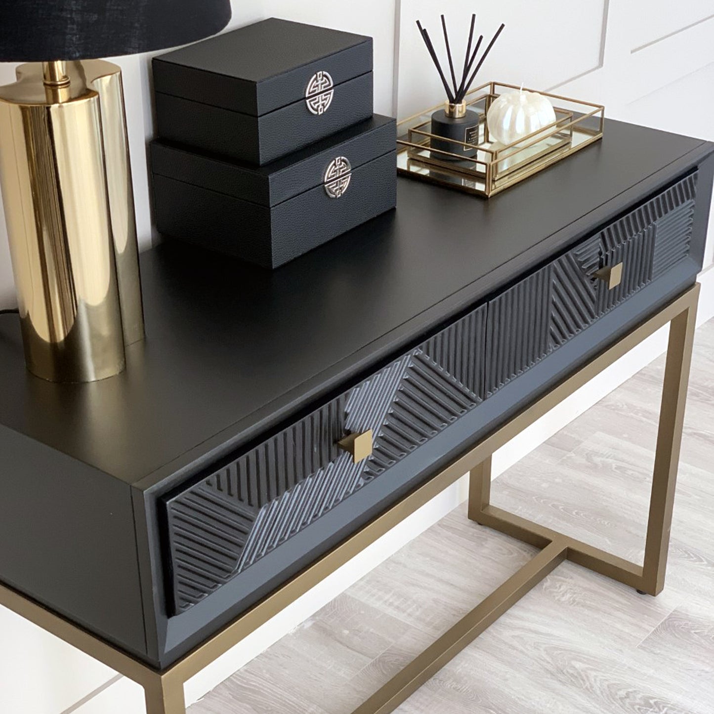 geometric black and gold console table